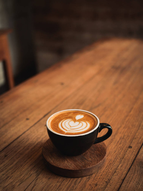 coffee latte on the wood desk in cafe - Φωτογραφία, εικόνα