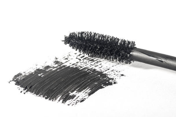 Mascara brush makes smear close-up isolated on white background - Photo, Image