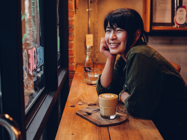 Asian woman drinking coffee in  coffee shop cafe   - Zdjęcie, obraz