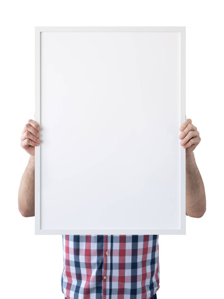 Holding frame mockup. Photo Mockup. The man hold frame. For frames and posters design. Frame size 20x28 (50x70cm). - 写真・画像