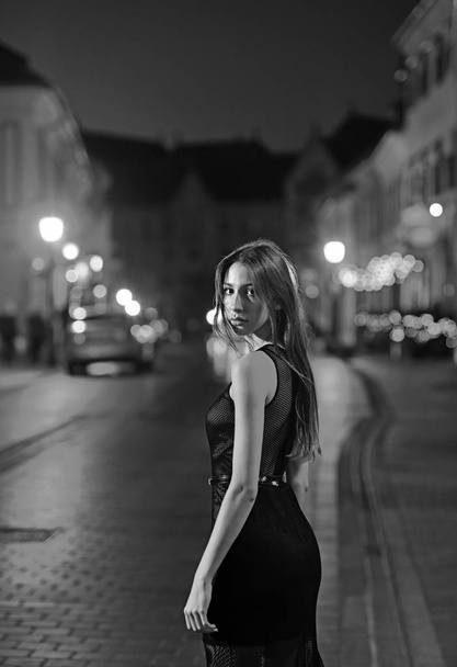 Fashion and beauty of business lady. Sexy girl in elegant dress. Girl with glamour makeup. Luxury woman in evening dress at night city going to prom party Night city with princess in celebrity style - Фото, изображение