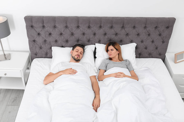 Couple with relationship problems in bed at home - Foto, immagini