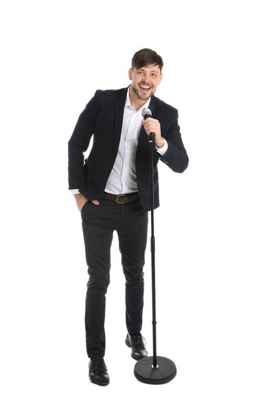 Handsome man in suit singing with microphone on white background - 写真・画像