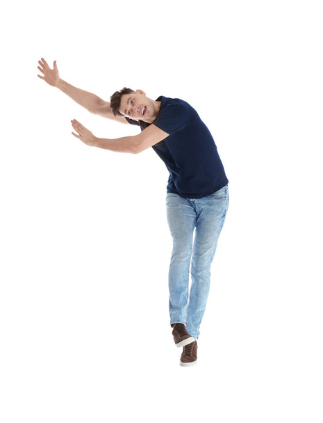 Emotional man in casual clothes posing on white background - Foto, afbeelding