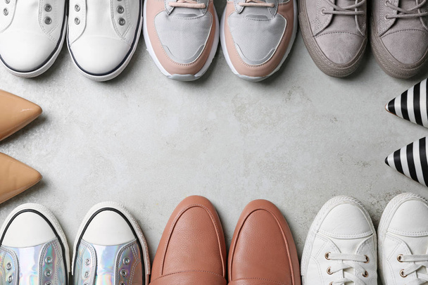 Flat lay composition with stylish shoes and space for text on grey background - 写真・画像
