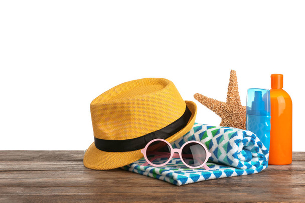 Set of different beach accessories on table against white background. Space for text - 写真・画像