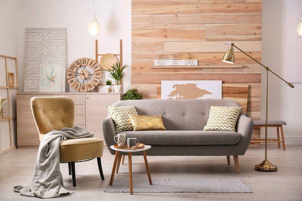 Stylish living room interior with comfortable sofa. Idea for home decor - Foto, immagini