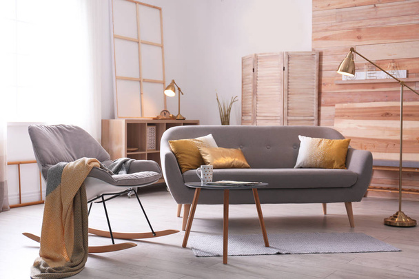 Stylish living room interior with comfortable sofa. Idea for home decor - Fotografie, Obrázek
