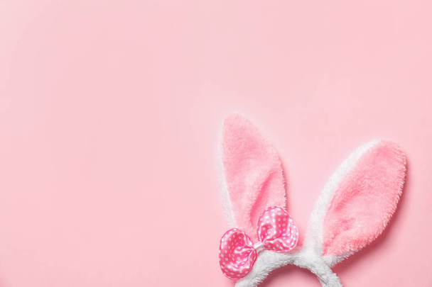 Funny headband with Easter bunny ears on color background, top view. Space for text - Фото, изображение