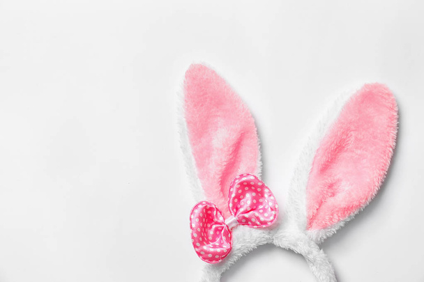 Funny headband with Easter bunny ears on white background, top view - Фото, изображение