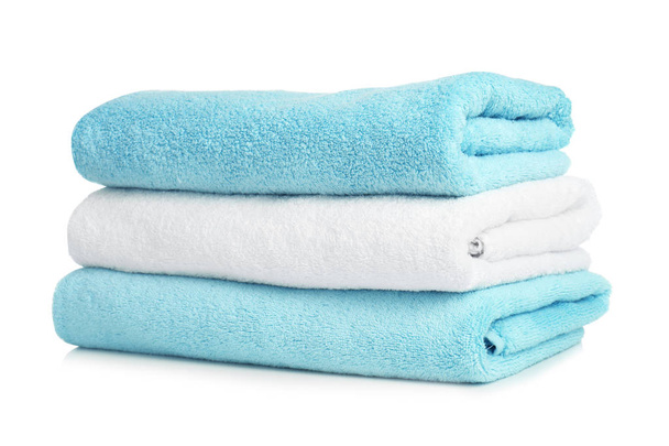 Folded soft terry towels on white background - Photo, image
