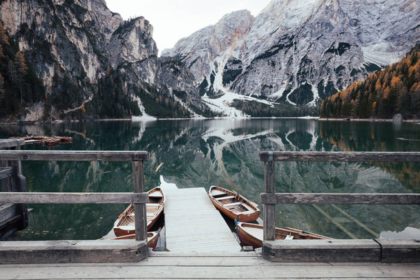 Wooden boats at the alpine mountain lake - Fotografie, Obrázek