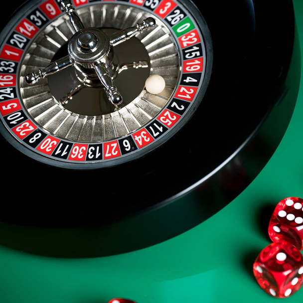  casino background, roulette wheel in motion and dice cubes - Photo, Image