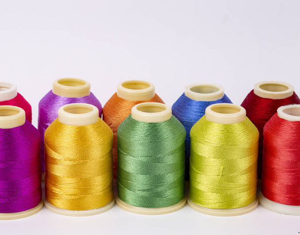 Multicolor Sewing Threads On Wooden Background Stock Photo, Picture and  Royalty Free Image. Image 28961608.
