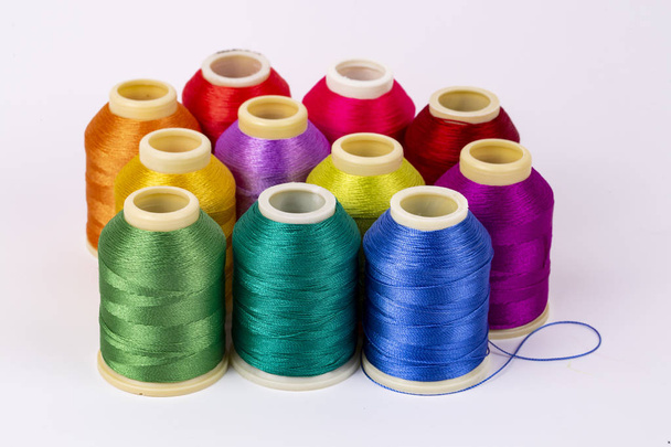 Colored thread coils on white background, sewing, place for text - Photo, Image