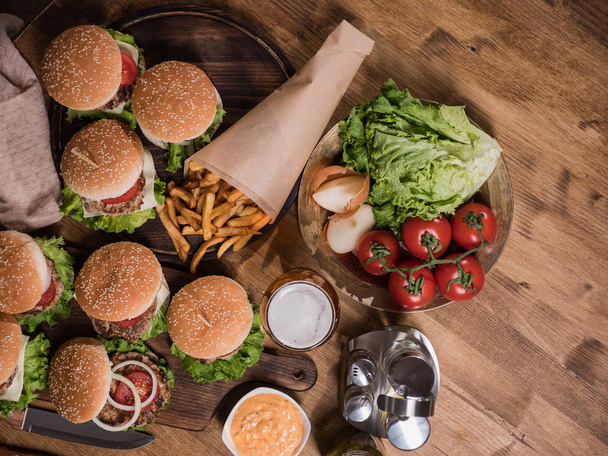 Top view of various fast food on a wooden table - Photo, Image