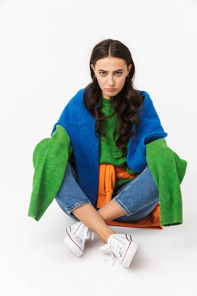 Image of frustrated woman 30s with dark hair in colorful clothes - Photo, image