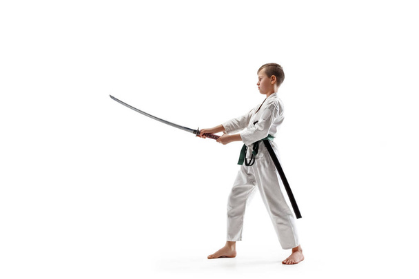 Teen boy fighting at aikido training in martial arts school - Фото, зображення