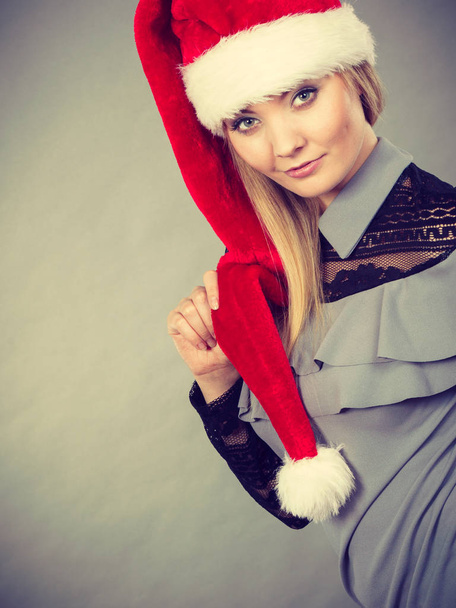 Happy woman wearing Santa Claus helper hat - Fotoğraf, Görsel