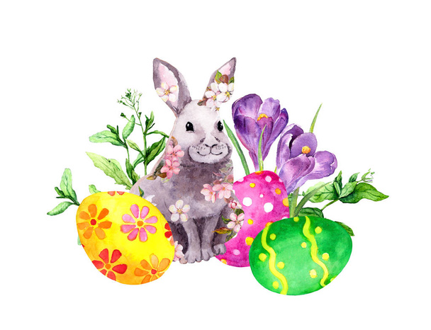 Easter bunny in pink flowers with colored eggs, grass, crocus flowers. Watercolor - Fotoğraf, Görsel