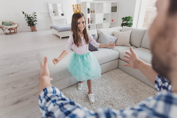Nice cute sweet lovely adorable attractive cheerful cheery positive stylish elegant exquisite pre-teen girl going to kind dad daddy hug in modern light white interior room indoors - Fotó, kép