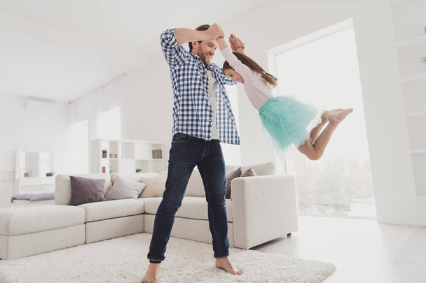 Close up photo little she her girl handsome he him his father hold princess game swirling spinning morning sunday wear jeans denim checkered plaid shirt light house in front sofa divan - Foto, Imagen
