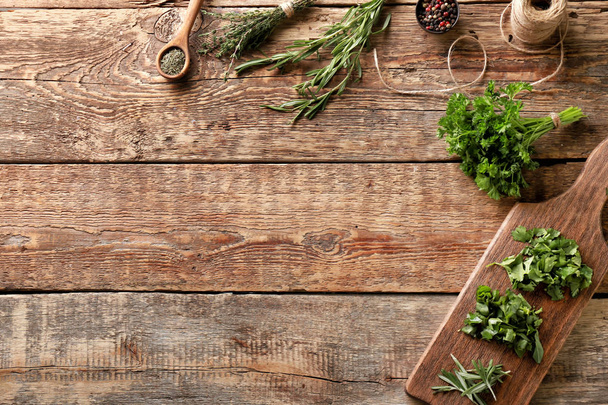 Different fresh herbs with spices on wooden background - Φωτογραφία, εικόνα