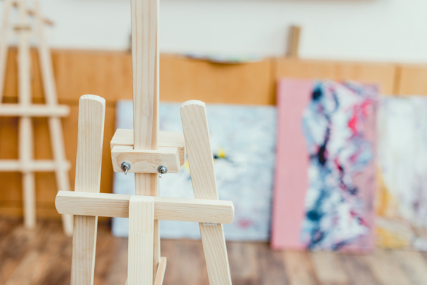 selective focus of wooden easel in painting studio - 写真・画像