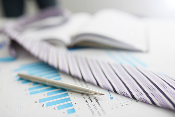 Financial statistics documents ball pen infographics at office - Фото, зображення
