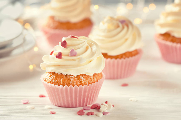 Delicious cupcake on white table - Fotografie, Obrázek