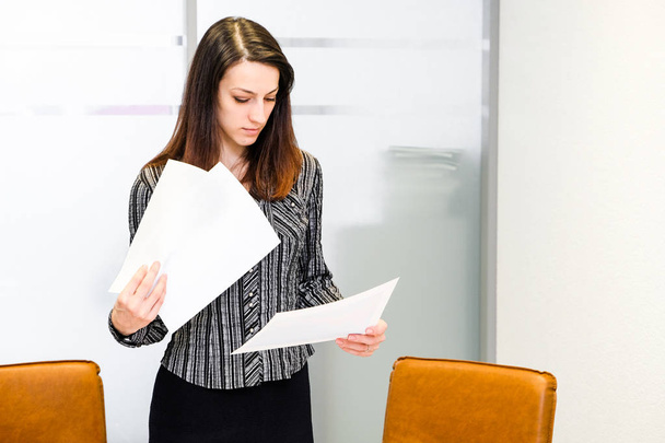 Young businesswoman works with documents - Photo, image