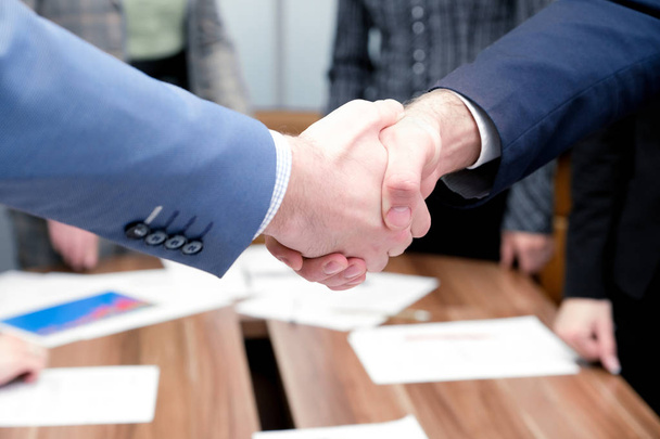 Businessmen shake hands each other - Фото, изображение