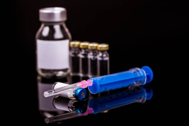 Sterile medical vials with medication solution, ampoules and syr - Photo, Image