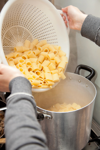 Cooking pasta with a colander - Photo, Image