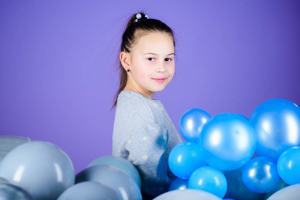 Carefree childhood. All those balloons for me. Happiness positive emotions. Obsessed with air balloons. Having fun. Balloons theme party. Girl between air balloons. Birthday party. Childrens day - Photo, image