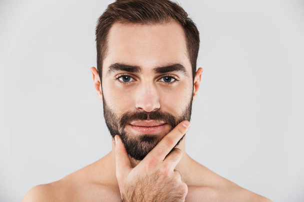 Close up of a young handsome bearded shirtless man - Фото, зображення