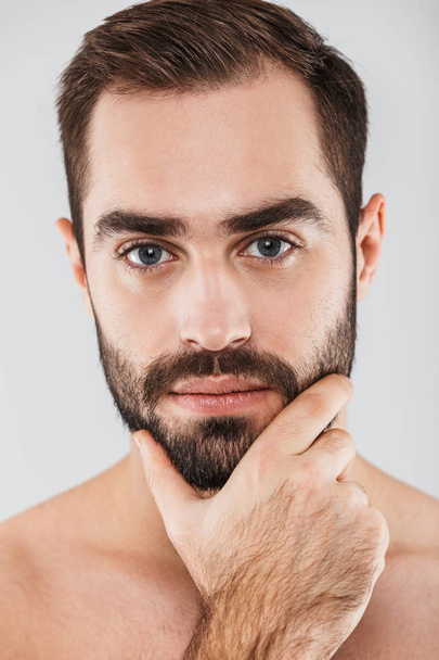 Close up of a young handsome bearded shirtless man - Zdjęcie, obraz