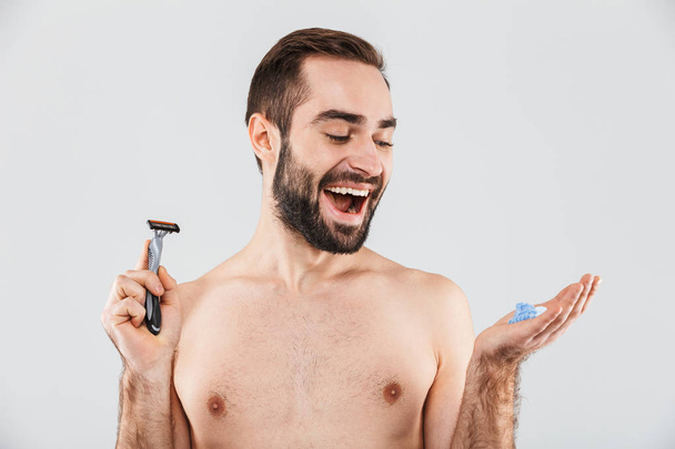 Portrait of a cheerful shirtless bearded man - Photo, Image