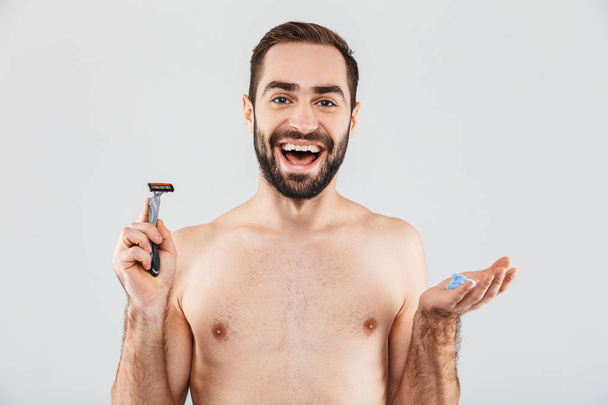 Portrait of a cheerful shirtless bearded man - Fotó, kép