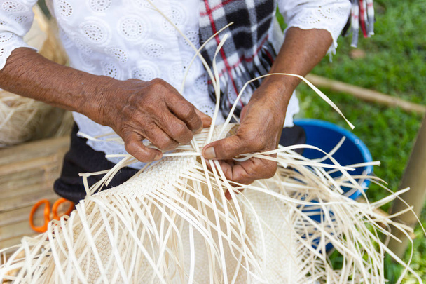 The villagers took bamboo stripes to weave into different forms for daily use utensils of the community people in Bangkok Thailand, Thai handmade product.   - Zdjęcie, obraz