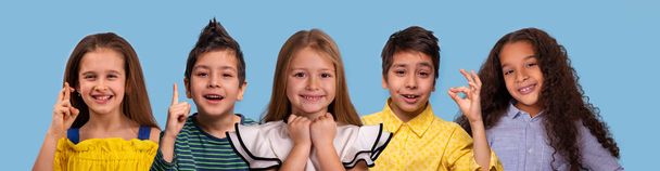 Studio  collage  of the  smiling schoolchilds of different races - Photo, image