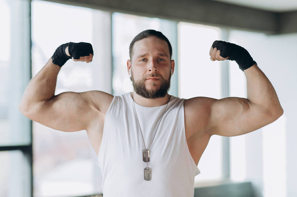Strong, muscular man, Apollo shows his muscles, torso, vein Delta press - Φωτογραφία, εικόνα
