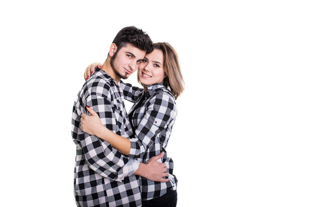 Couple in skirts hugging isolated on white - Fotoğraf, Görsel