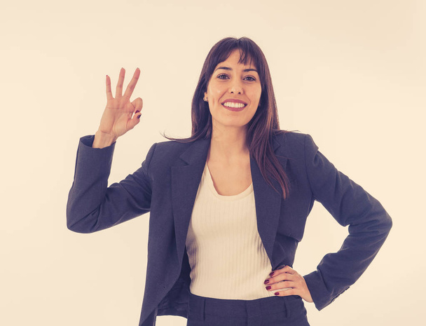 Half length portrait of young pretty business woman standing and making all OK gesture. Smiling feeling confident and successful. In people business education, success and work environment concept. - Fotoğraf, Görsel