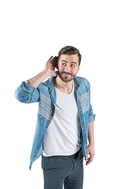 Young casual man listening, isolated - Photo, image
