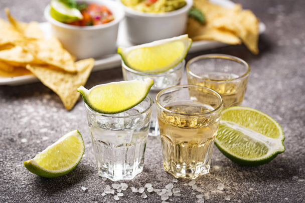 Shots of silver and gold tequila - Photo, Image