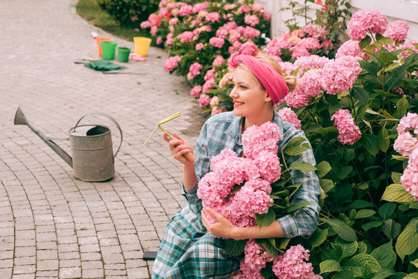 Flower care and watering. soils and fertilizers. hydrangea. Spring and summer. Greenhouse flowers. woman care of flowers in garden. happy woman gardener with flowers. Source of beauty - Fotografie, Obrázek
