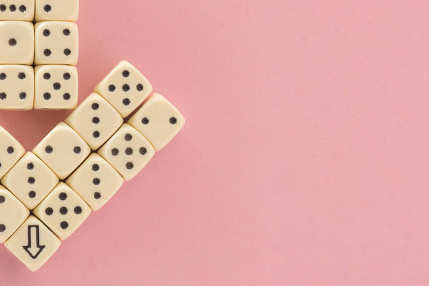 White gaming dices on pink background. victory chance, lucky. pointer. Flat lay, place for text. Top view. Close-up. Concept gamble. spectacular pastel - Foto, afbeelding