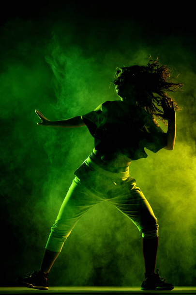 silhouette zumba dancer with smoke background - Фото, изображение