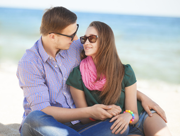 Portrait of young man and woman on a beach - Photo, Image
